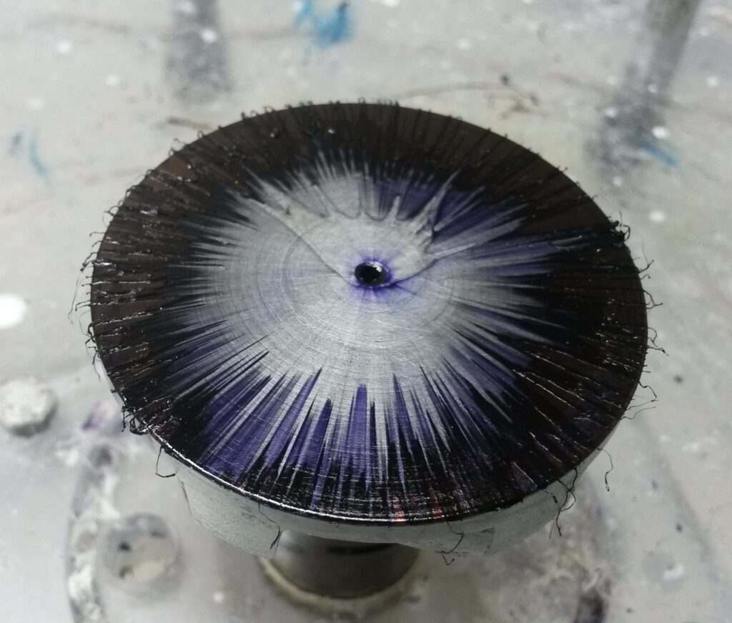 Centrifugal spin painting titled The Big Bang Theory showing colourful radial patterns created by rotational spinning technique