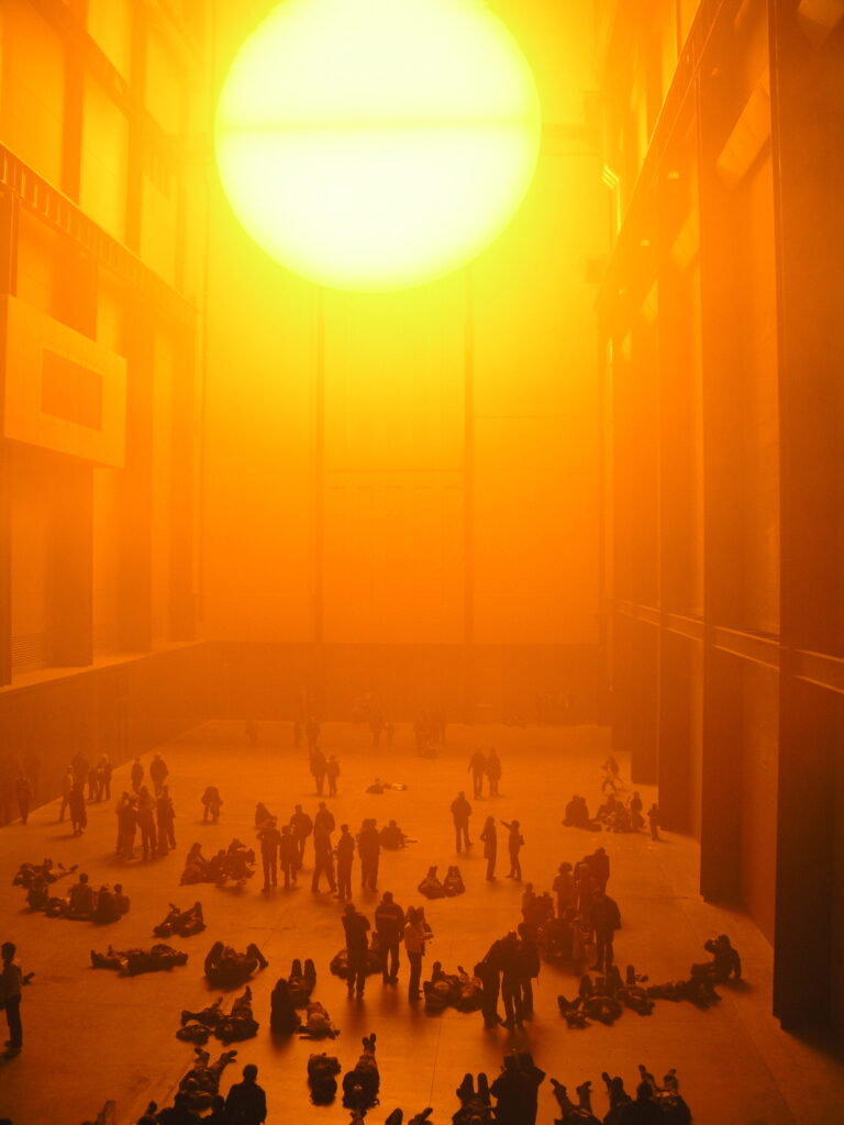 Olafur Eliasson The Weather Project 2003 artificial sun installation Tate Modern Turbine Hall with visitors as silhouettes