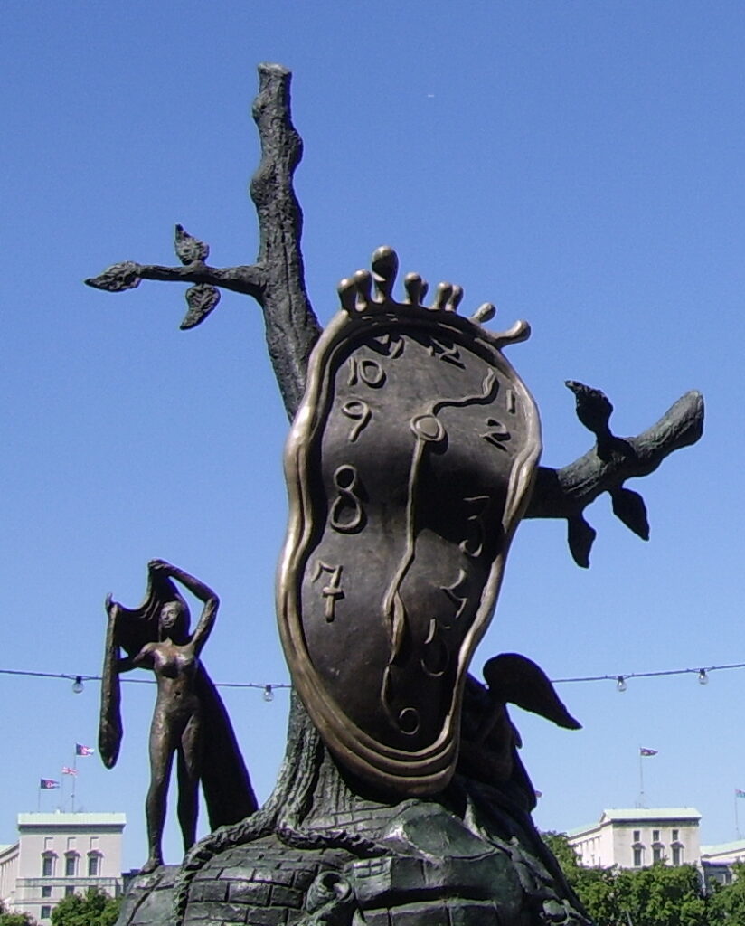 Salvador Dalí Nobility of Time bronze sculpture showing a melting soft watch draped over a tree with a royal crown on top
