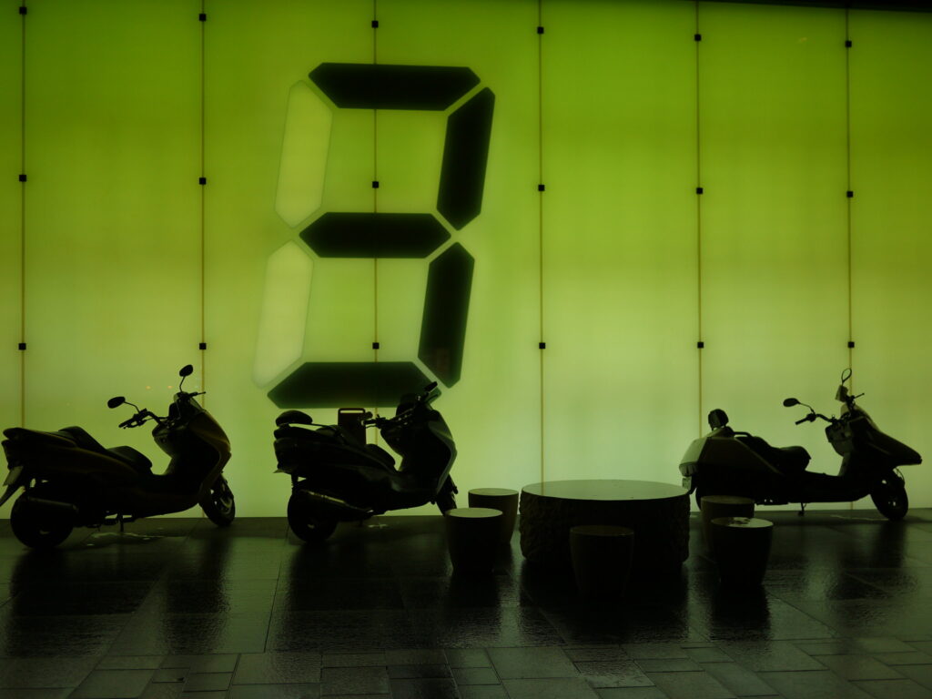 Tatsuo Miyajima LED counter installation showing glowing numerical digits cycling in a darkened space